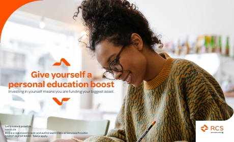 Woman smiling while writing