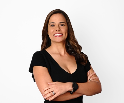 Smiling woman folding her arms