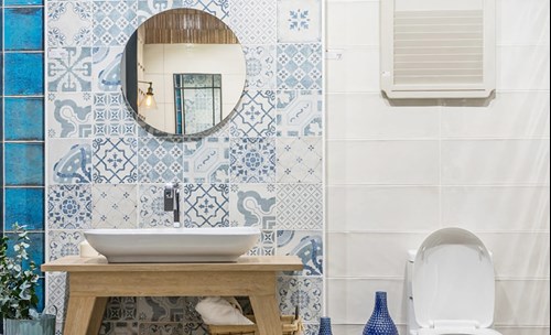 Bathroom interior - Mosaic blue wall with mirror on, hand basin, toilet