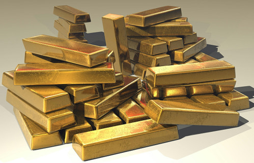 Stacked gold bars symbolising gold investment