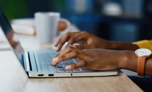 Person typing on laptop