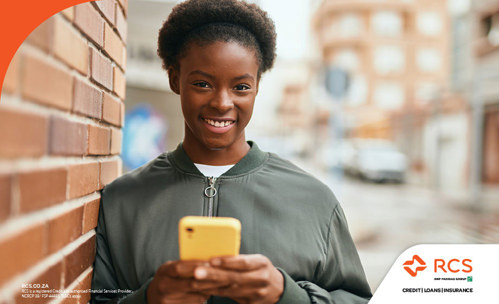 Optimistic woman in South Africa researching loans without credit scores on her phone, smiling confidently